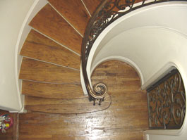 Photograph of circular wood staircase from starter step