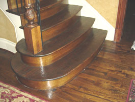 Photograph of circular wood staircase from starter step