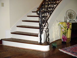 Photograph of circular wood staircase from starter step