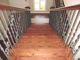Photograph of circular wood staircase from starter step