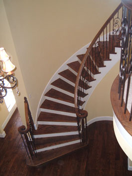 Looking down over a circular wood staircase