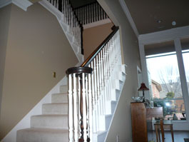 Before staircase with wood balusters
